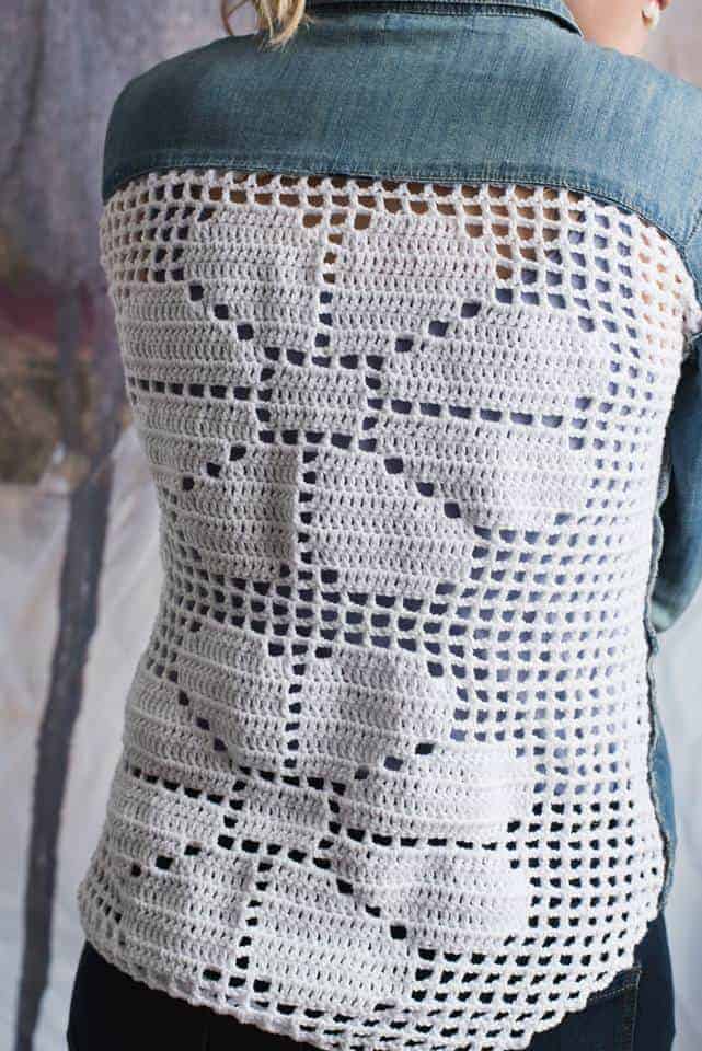 Upcycle a chambray button-up shirt with a filet crochet panel to make it into a new boutique essential. Read this article and follow this pattern from I Like Crochet Magazine to create your own new fashion accessories. The fashion world is filled with crochet panels and mixed media pieces. Now you can upgrade items from the thrift store with crochet!