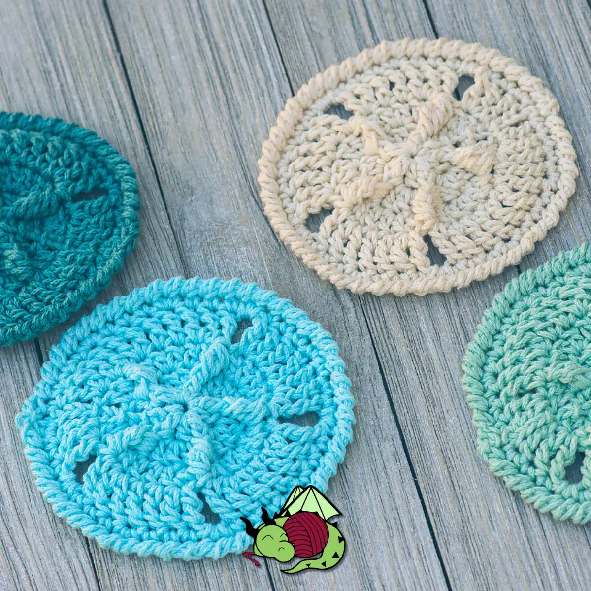 crochet sand dollars in shades of blue cotton yarn on a wooden background